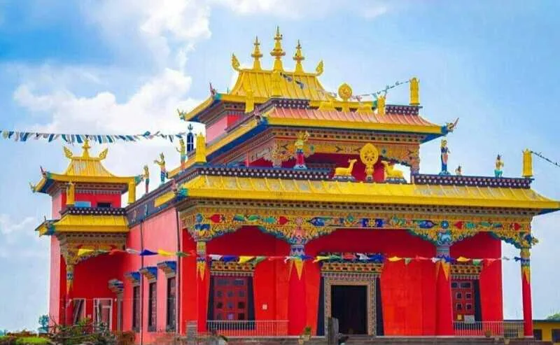 Colorful Buddhist monastery with traditional Tibetan architecture under a bright sky