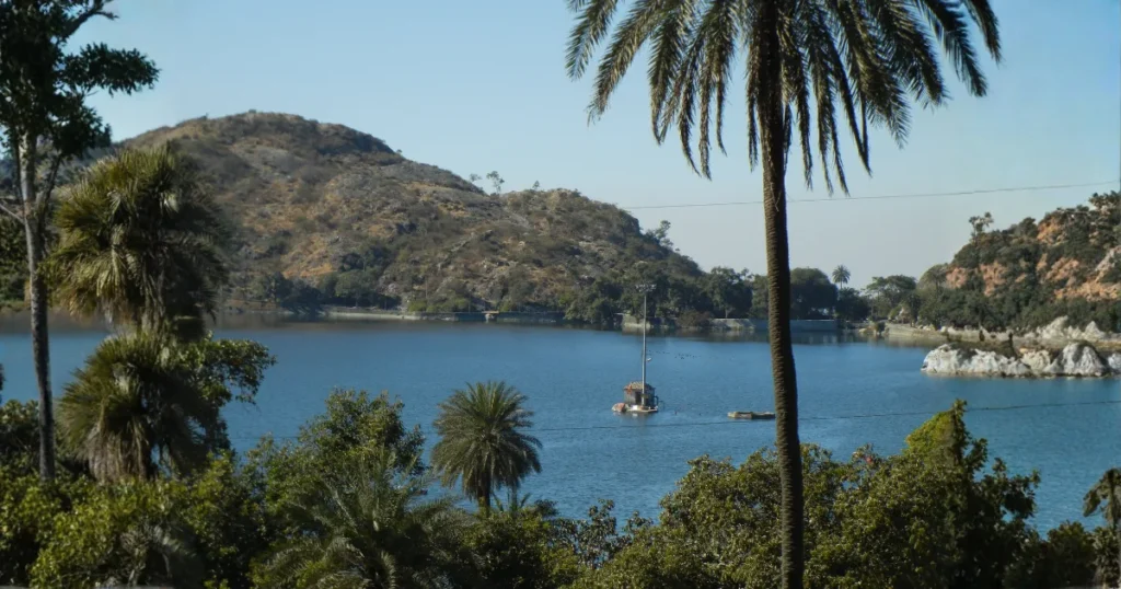Nakki Lake Mount Abu during daytime with Aravalli hills and palm trees