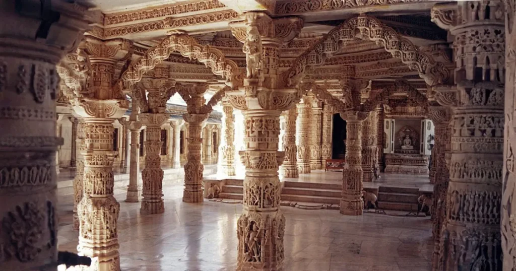 Interior of Luna Vasahi temple Dilwara Temples Mount Abu showing intricate white marble pillar carvings